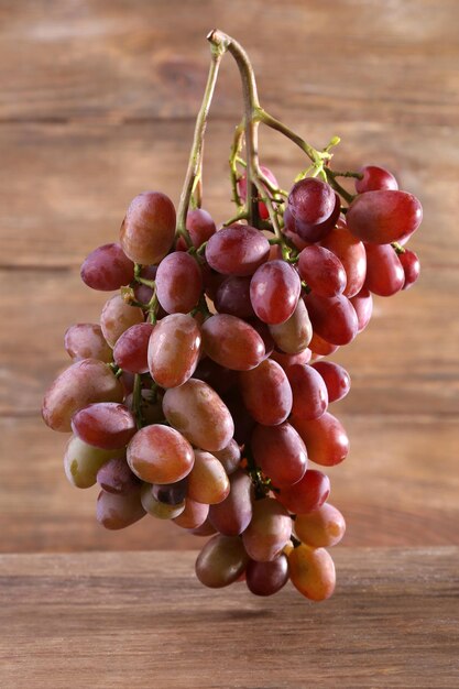 Bunch of grape on wooden background