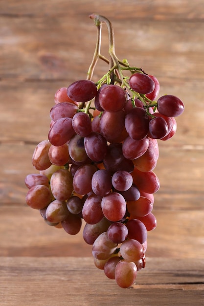 Bunch of grape on wooden background