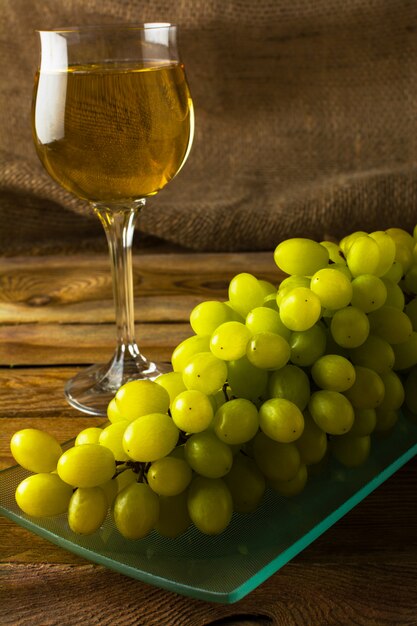 Bunch of grapes and wine in a glass