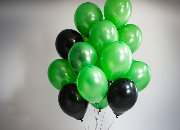 A bunch of green and black balloons with the number 4 on them.