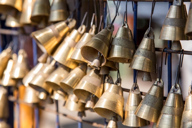 Bunch of hanging small brass bells Bells like a souvenir