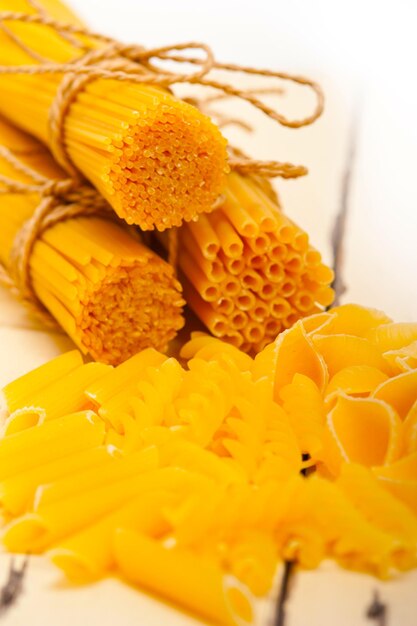 Bunch of italian pasta type on a white rustic table