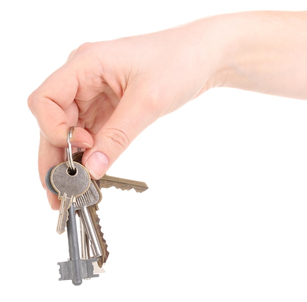 Bunch of keys in hand isolated on white