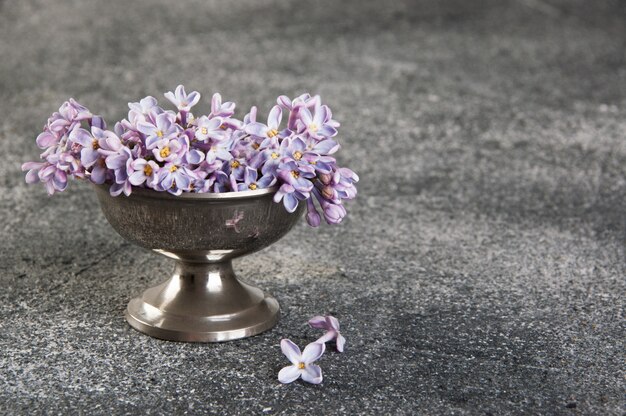 Bunch of lilac in vintage bowl