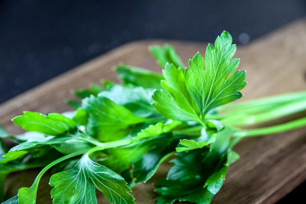 Bunch of parsley stem on a wooden cutting board