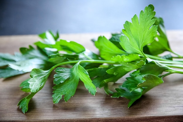 Bunch of parsley stem on a wooden cutting board