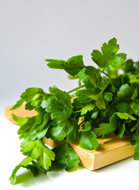 a bunch of parsley on a wooden box