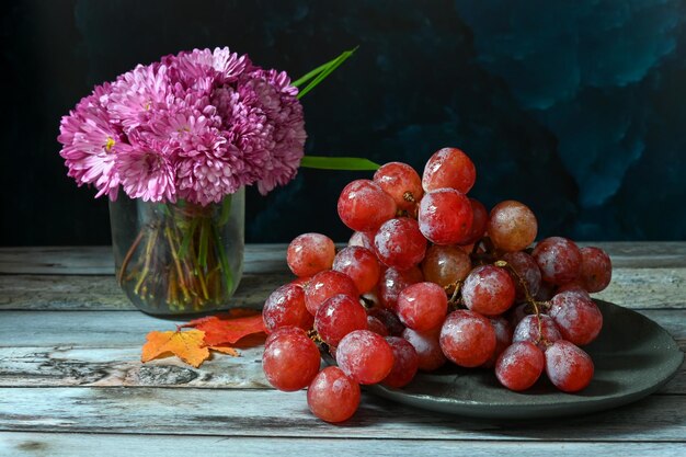 Bunch of pink grapes on a dark background