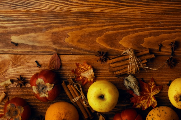 A bunch of pumpkins and apples.