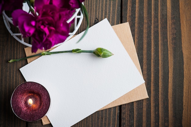 Bunch of purple carnations and card