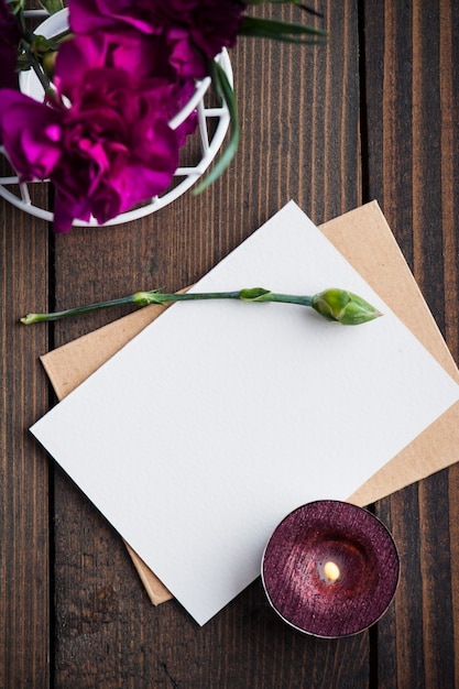 Bunch of purple carnations and card