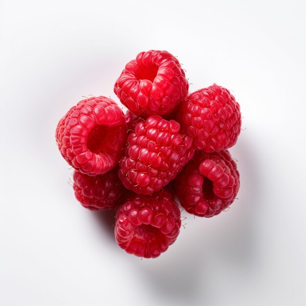 A bunch of raspberries are on a white background.