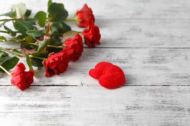 Bunch of red roses on table