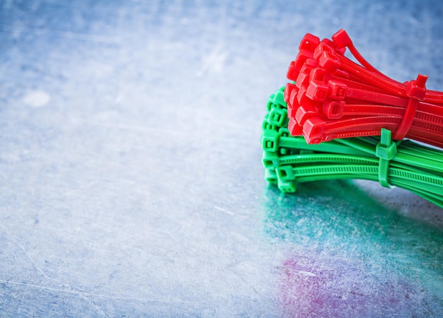 Photo bunch of selflocking cable ties on metallic background construc