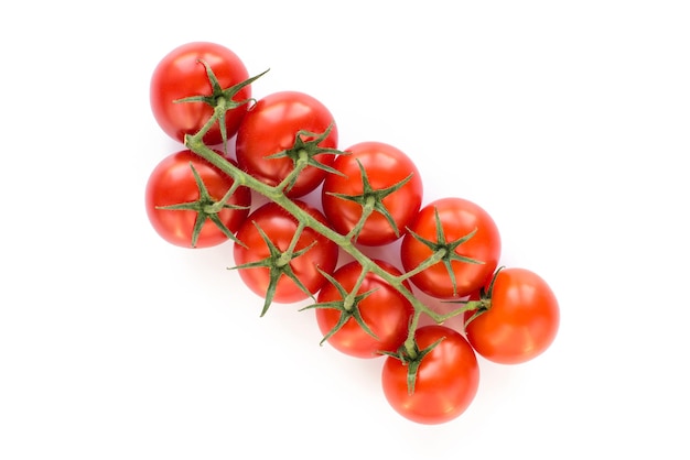 A bunch of tomatoes on a vine