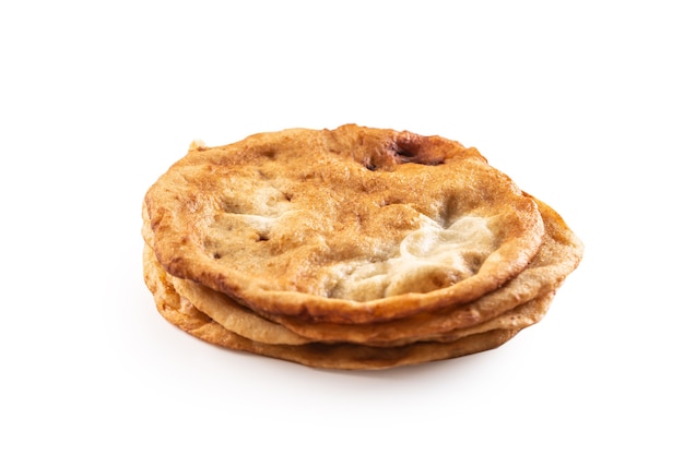 A bunch of traditional hungarian deep-fried langos in an isolated white backround.