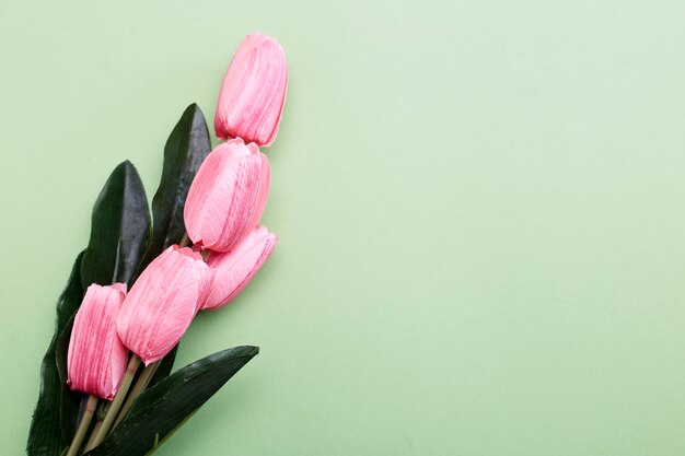 Bunch of tulip flowers on green