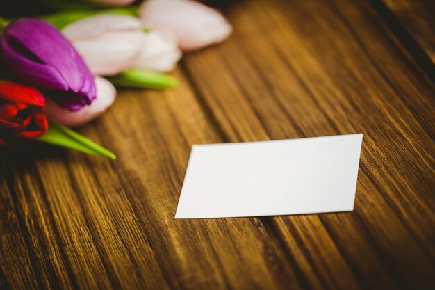 Bunch of tulips and white card