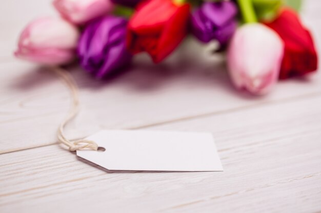 Bunch of tulips and white card