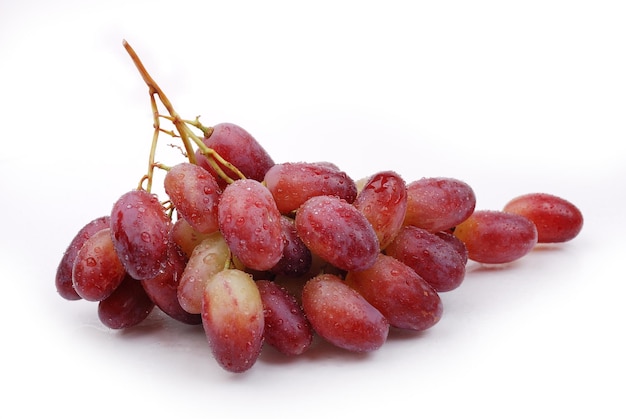 Bunch of wet red grape isolated on white