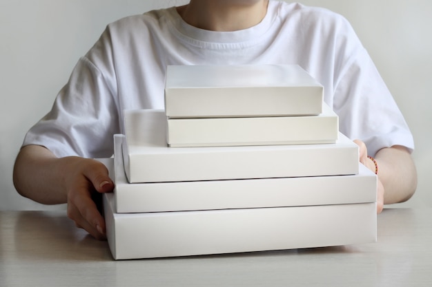 A bunch of white boxes in their hands