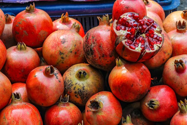 A bunch of whole ripe pomegranates.