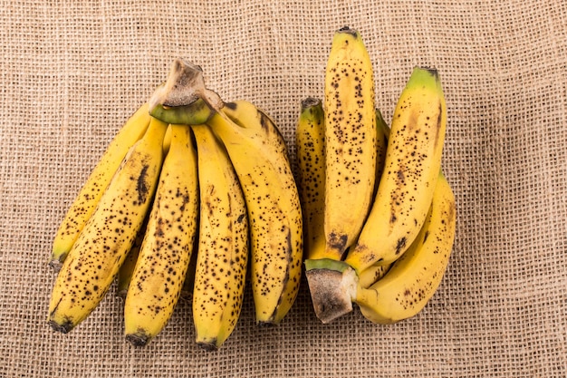 Bunch of yellow freckled bananas