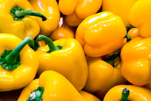 Bunch of yellow peppers in a greengrocery