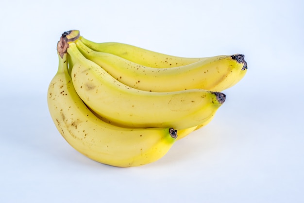 Photo bunch of yellow ripe bananas isolated on white