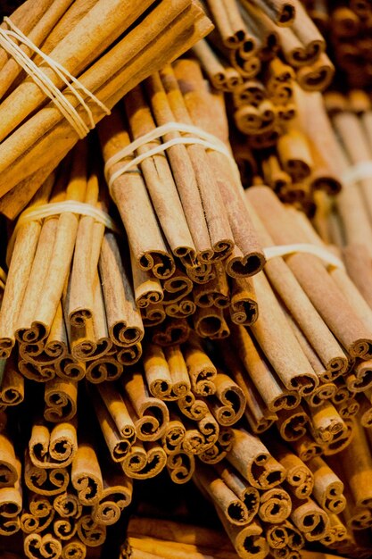 Bunches of cinnamon sticks in a herbal shop