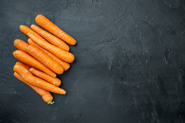 Bunches of colorful orange carrots set