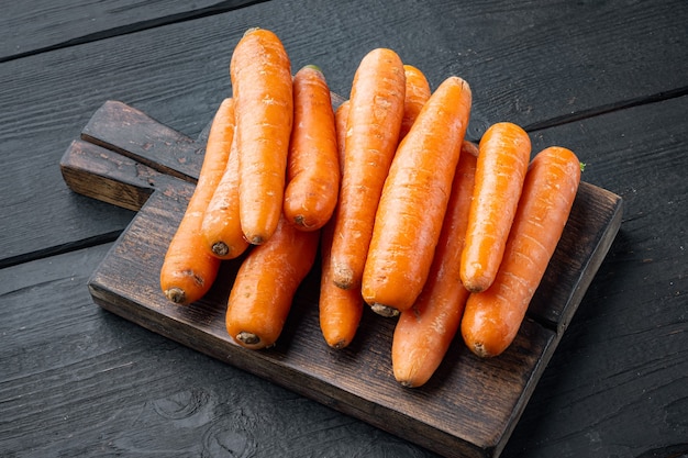 Bunches of colorful orange carrots set