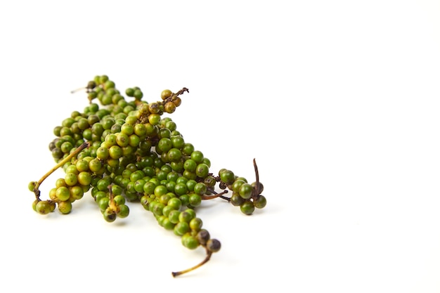 Bunches of fresh green peppercorns