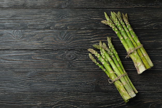 Bunches of green asparagus on wooden