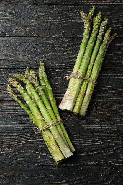 Bunches of green asparagus on wooden