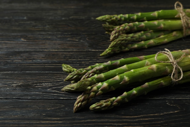 Bunches of green asparagus on wooden