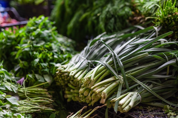 Bunches of green onions on display at a farmers' market