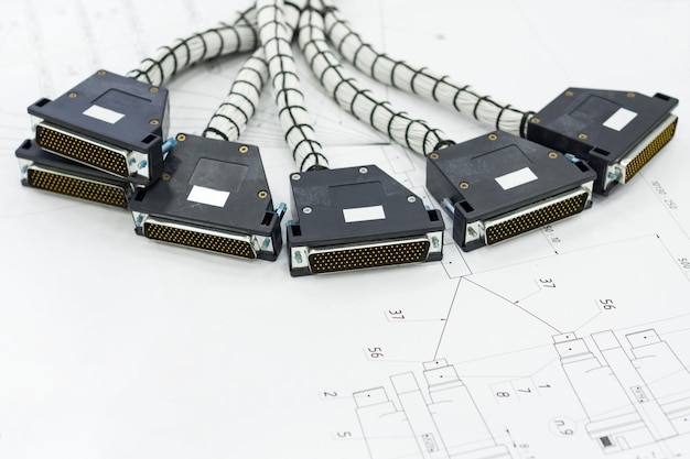 A bundle of cable harnesses lies on the table