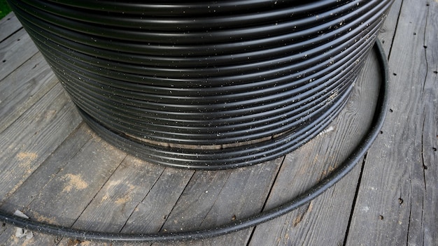 Photo bundle of cable on wooden floor