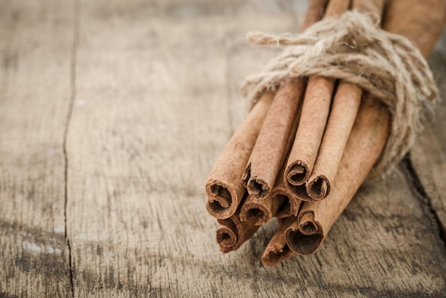 Photo bundle of cinnamon on table