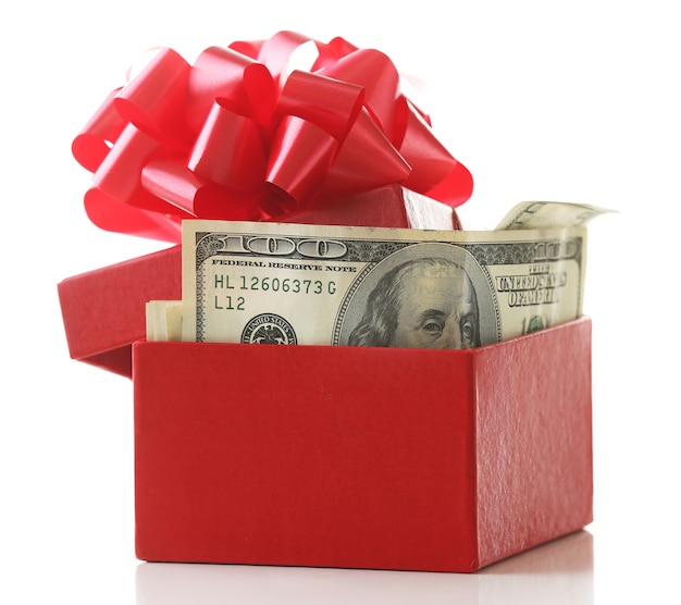 Bundle of dollars in present box with bow isolated on white