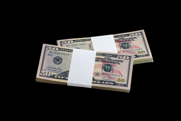 Bundle of US dollar bills isolated on black Pack of american money with high resolution on perfect black background