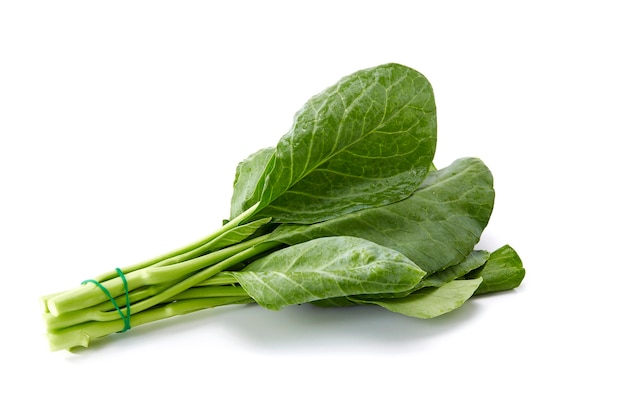 Bundle of water drops on fresh Chinese kale vegetable on white background