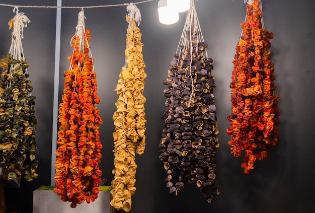 Bundles of sun dried vegetables hanging up at Turkish bazaar