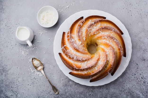 Bundt cake with sugar glaze and coconut