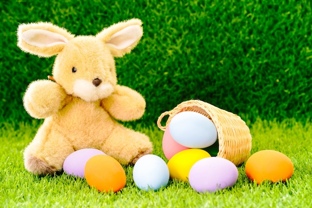 Bunny toy and Easter eggs in basket