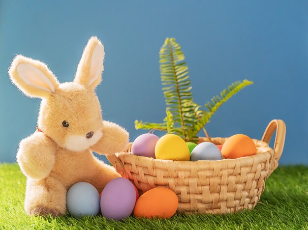 Bunny toy and Easter eggs in a basket