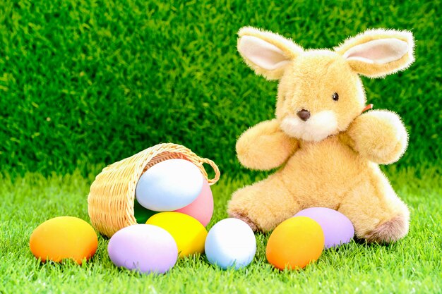 Bunny toy and Easter eggs in a basket