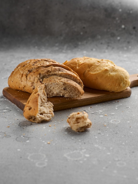 Buns with seeds and grain on a stone texture