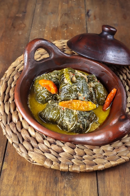 Buntil daun singkong is made from cassava leaves stuffed with grated coconut petai cina and anchovy